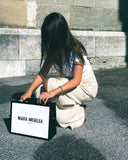 Mara Megelea fine jewelry client experience moment with branded packaging and luxury purchase presentation