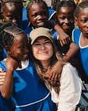 Mara Megelea during gemstone sourcing expedition in Sierra Leone with local community and ethical mining partners